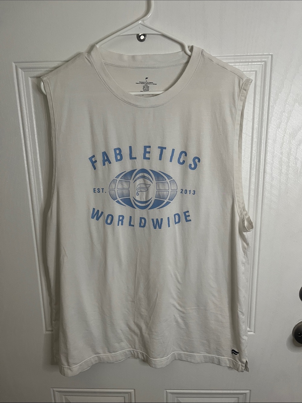 Fabletics White Muscle Tank with Light Blue Worldwide Graphic